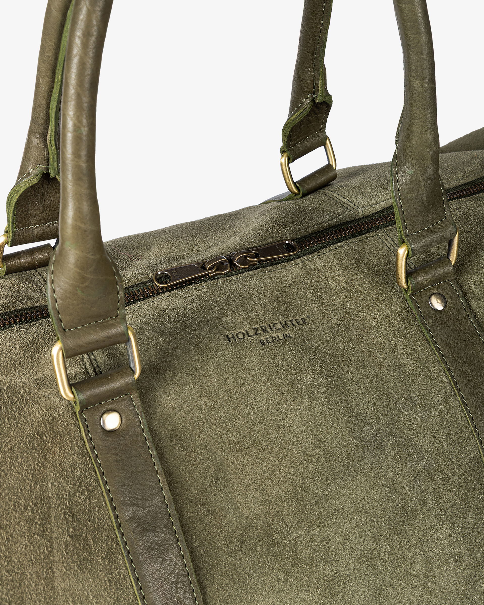 Handgefertigtes Lederaccessoire in hellbrauner Farbe mit Nahtdetails und glatter Oberfläche